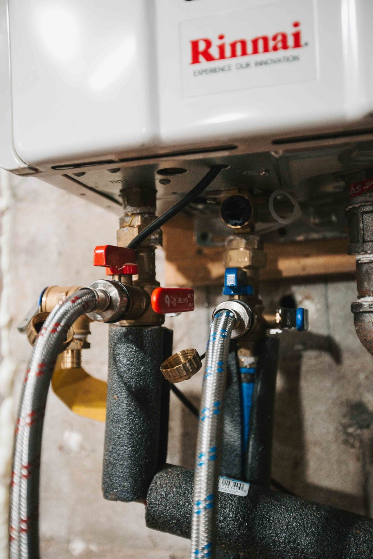 Rinnai tankless water heater with plumbing connections